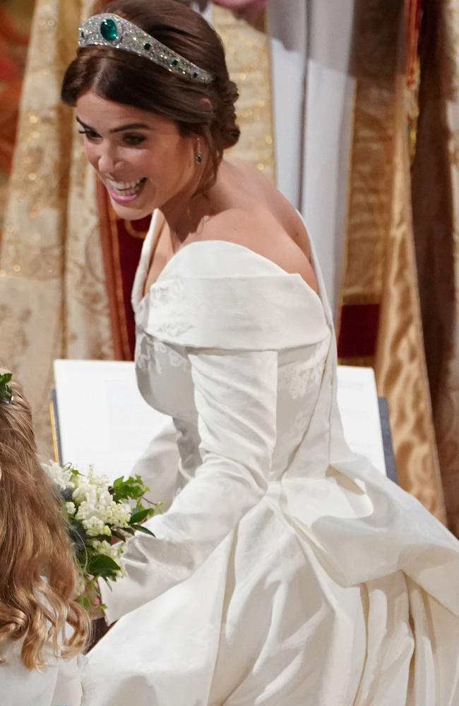 Princess Eugenie of York passes her bouquet to bridesmaid Savannah Phillips during her wedding to Jack Brooksbank at St. George’s Chapel on October 12, 2018 in Windsor, England. (Photo by - WPA Pool/Getty Images)