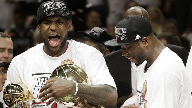 LeBron James and Dwyane Wade celebrate an NBA championship in Miami.