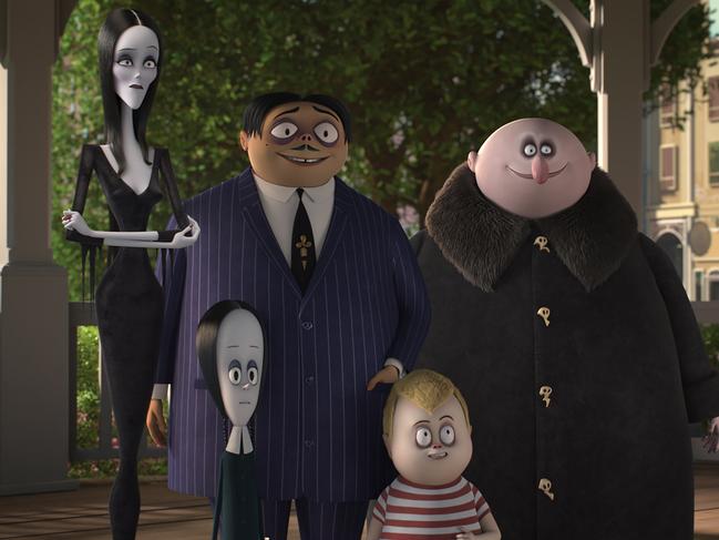 Morticia (Charlize Theron), Wednesday (Chloe Grace Moretz), Gomez (Oscar Isaac), Pugsley (Finn Wolfhard), and Uncle Fester (Nick Kroll) in The Addams Family.