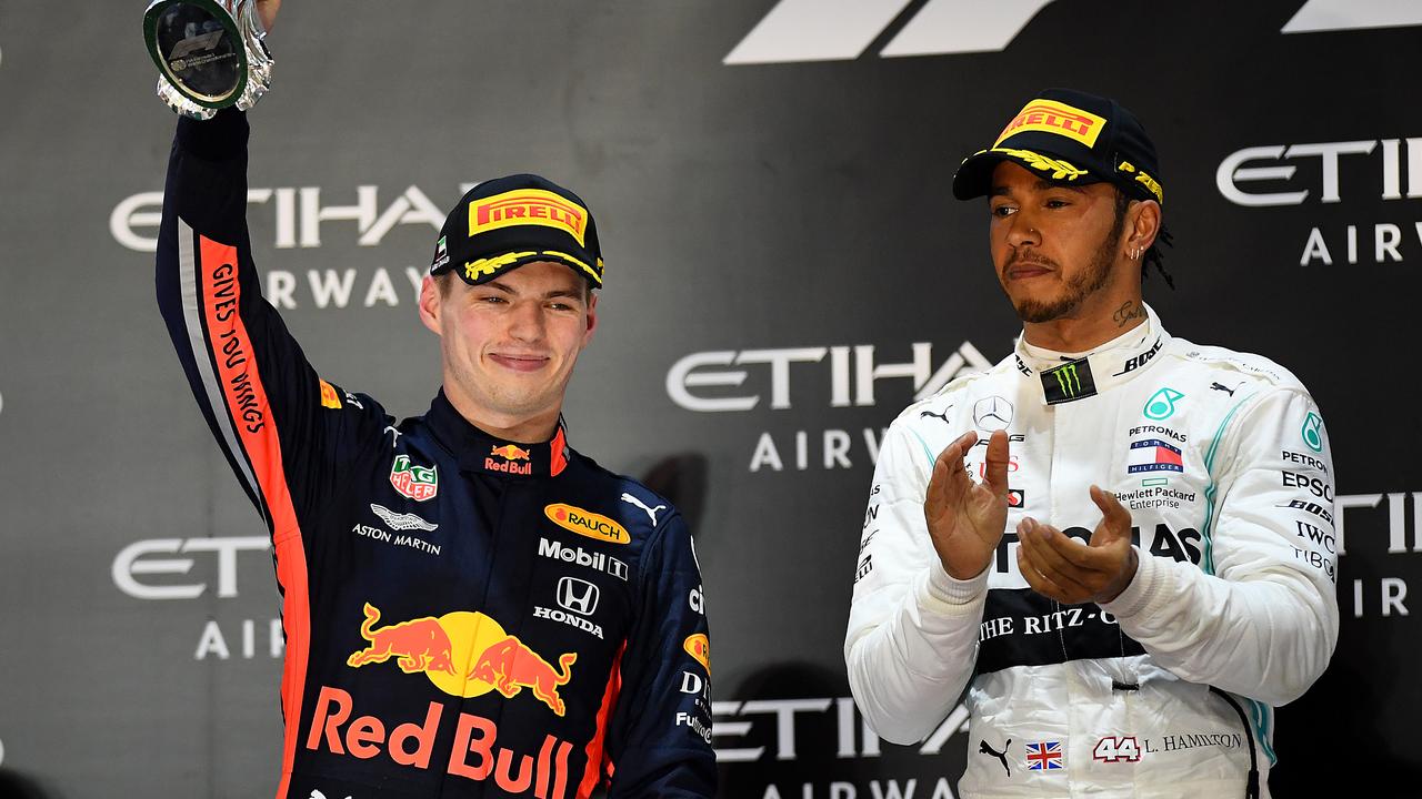 Verstappen and Hamilton celebrate on the podium.