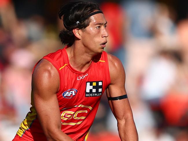 GOLD COAST, AUSTRALIA - AUGUST 17: Alex Davies of the Suns kicks during the round 23 AFL match between Gold Coast Suns and Melbourne Demons at People First Stadium, on August 17, 2024, in Gold Coast, Australia. (Photo by Chris Hyde/Getty Images)