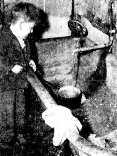 A boy in a bathroom in an old house at Fleet Street in 1952. Picture: The Herald