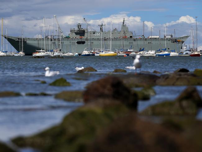 Being fitted out ... HMAS Canberra dwarfs other boats and yachts at Williamstown dockyard. Picture: Mark Stewart