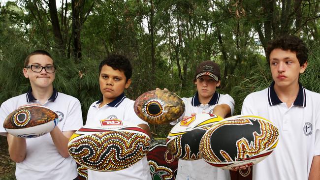 Students at Erskine Park High School are painting footballs for the City v Country rugby League game.Rodney Carlin, Hayden Day, Tremayne Yule and Brendan Thompson