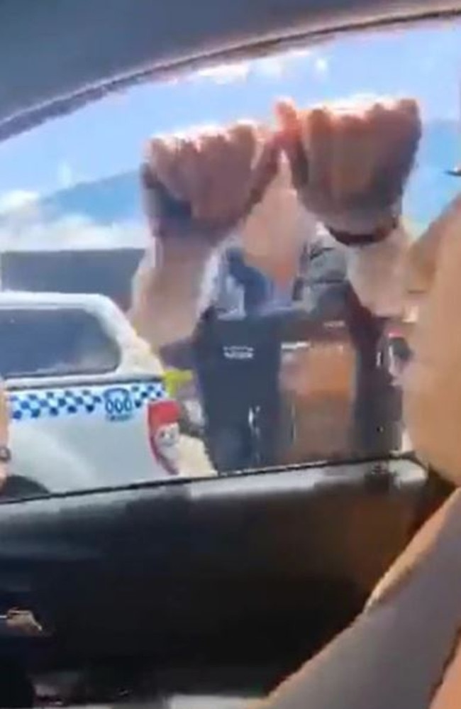 The officer smashes the car window in the viral video. Picture: Supplied