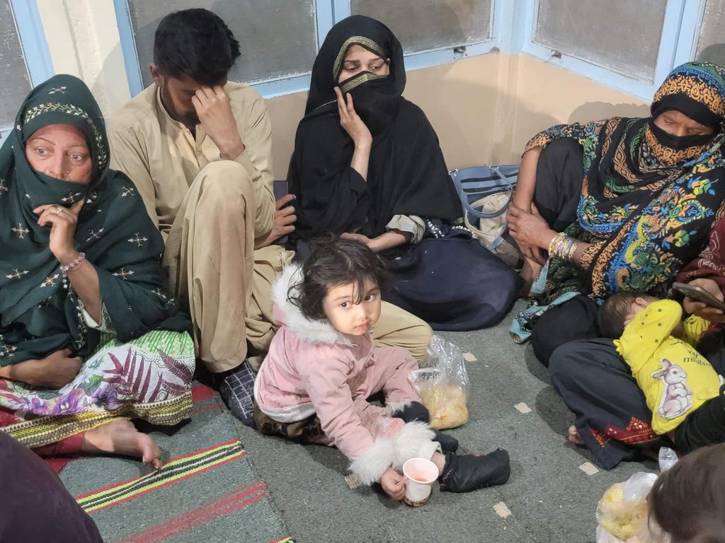 Freed train passengers gather at the Mach railway station after Pakistani troops freed dozens of train passengers taken hostage by armed militants in the country's southwest. Picture: AFP