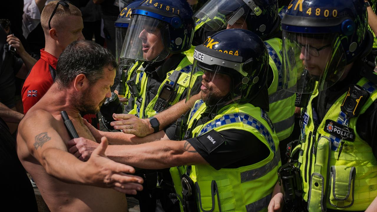 Police clash with protesters in Piccadilly Gardens, Manchester. Picture: Getty Images