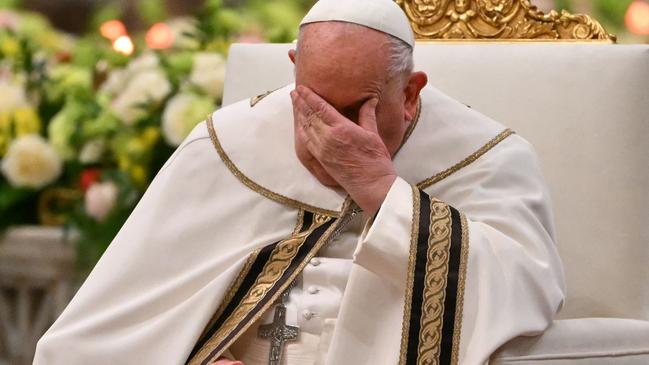 (FILES) Pope Francis gestures during the vespers at Saint Paul Outside the Walls, in Rome on January 25, 2025. Pope Francis was admitted to hospital in Rome on February 14, 2025 for tests and treatment for ongoing bronchitis, the Vatican announced. (Photo by Andreas SOLARO / AFP)