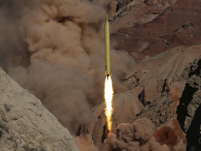 In this March 9, 2016 file photo obtained from the Iranian Fars News Agency, a Qadr H long-range ballistic surface-to-surface missile is fired by Iran's powerful Revolutionary Guard. Picture: AP