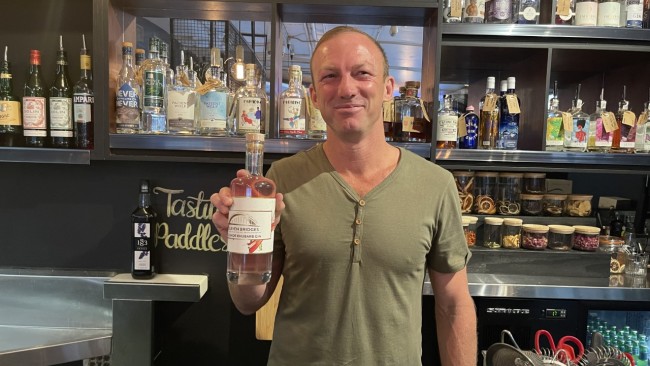 League legend Darren Lockyer has a chain of bottle shops and makes his own gin. He is pictured here at his Black Sheep bottle shop and gin bar in South Brisbane. Photo: Des Houghton.