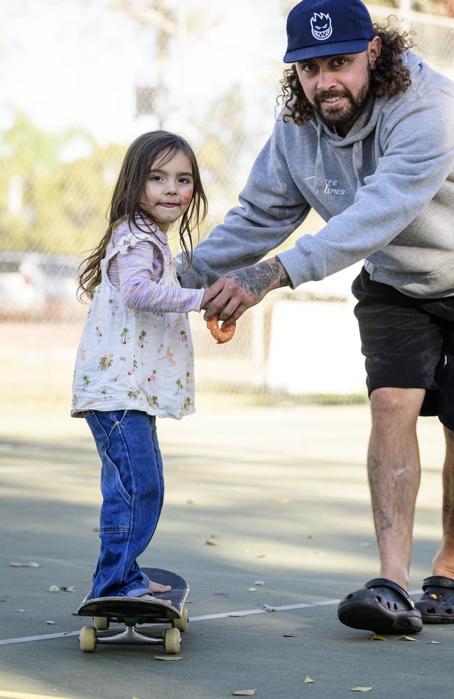 Mayii Weribone learns to skateboard with the help of dad Josh Weribone at Sadie's Day Out, a special community event to celebrate the life of five-year-old crash victim Sadie, held at Cambooya State School, Saturday, June 7, 2025. Picture: Kevin Farmer