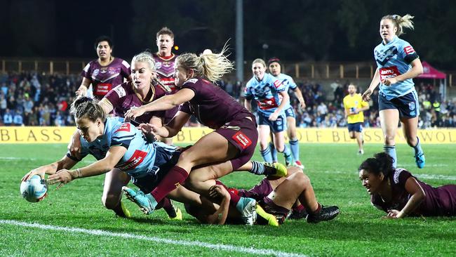 Isabelle Kelly scores a try during the women's State of Origin match between New South Wales and Queensland at North Sydney Oval last year. 