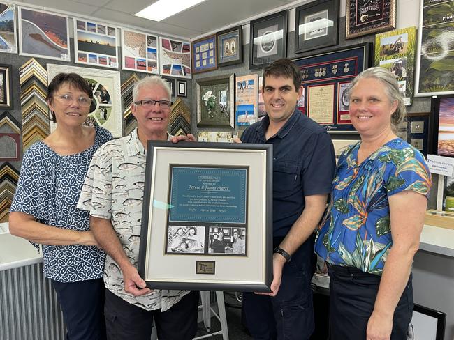 TJ Framing new owners Rod and Cindy Lawn presented founders Terese and James Marrs with a framed memorial of their time. Photo: Zoe Devenport