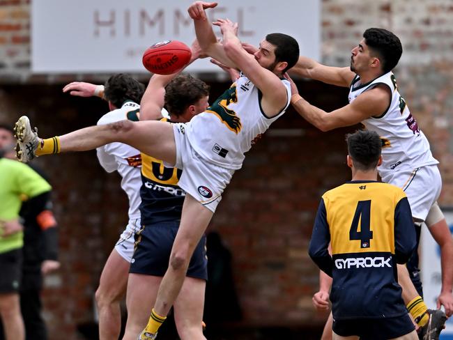 Hurstbridge and Northcote Park players fly for the mark. Picture: Andy Brownbill