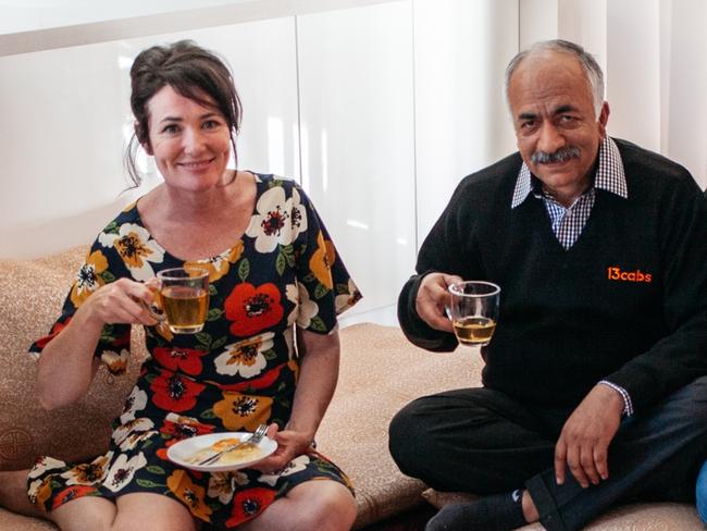 Karimullah Zarifi and his family enjoy a meal with celebrity cook Anna Gare. Picture: Tim Thatcher