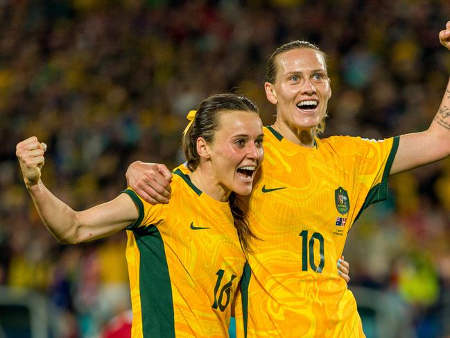 Emily van Egmond (right) celebrates with Matildas teammate Hayley Raso at last year’s FIFA Women’s World Cup. Picture: Andy Cheung/Getty Images