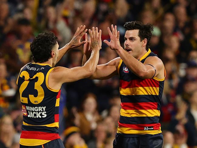 ADELAIDE, AUSTRALIA - MARCH 22: Darcy Fogarty of the Crows celebrates a goal with Izak Rankine of the Crows during the 2024 AFL Round 2 match between the Adelaide Crows and the Geelong Cats at Adelaide Oval on March 22, 2024 in Adelaide, Australia. (Photo by Sarah Reed/AFL Photos via Getty Images)