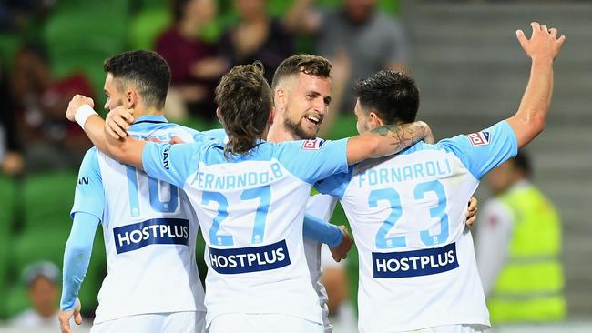Nicolas Colazo of Melbourne City is congratulated by team mates after scoring.