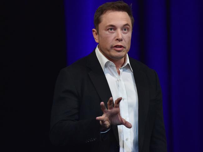 (FILES) In this file photo taken on September 29, 2017 Billionaire entrepreneur and founder of SpaceX Elon Musk speaks at the 68th International Astronautical Congress 2017 in Adelaide.  Musk will only get paid if the company's stock soars but would receive a stunning sum if it does, according to a plan approved by shareholders on march 21, 2018. A Tesla spokesperson confirmed that shareholders voted to approve the proposal for a multi-billion-dollar, 10-year performance stock award 