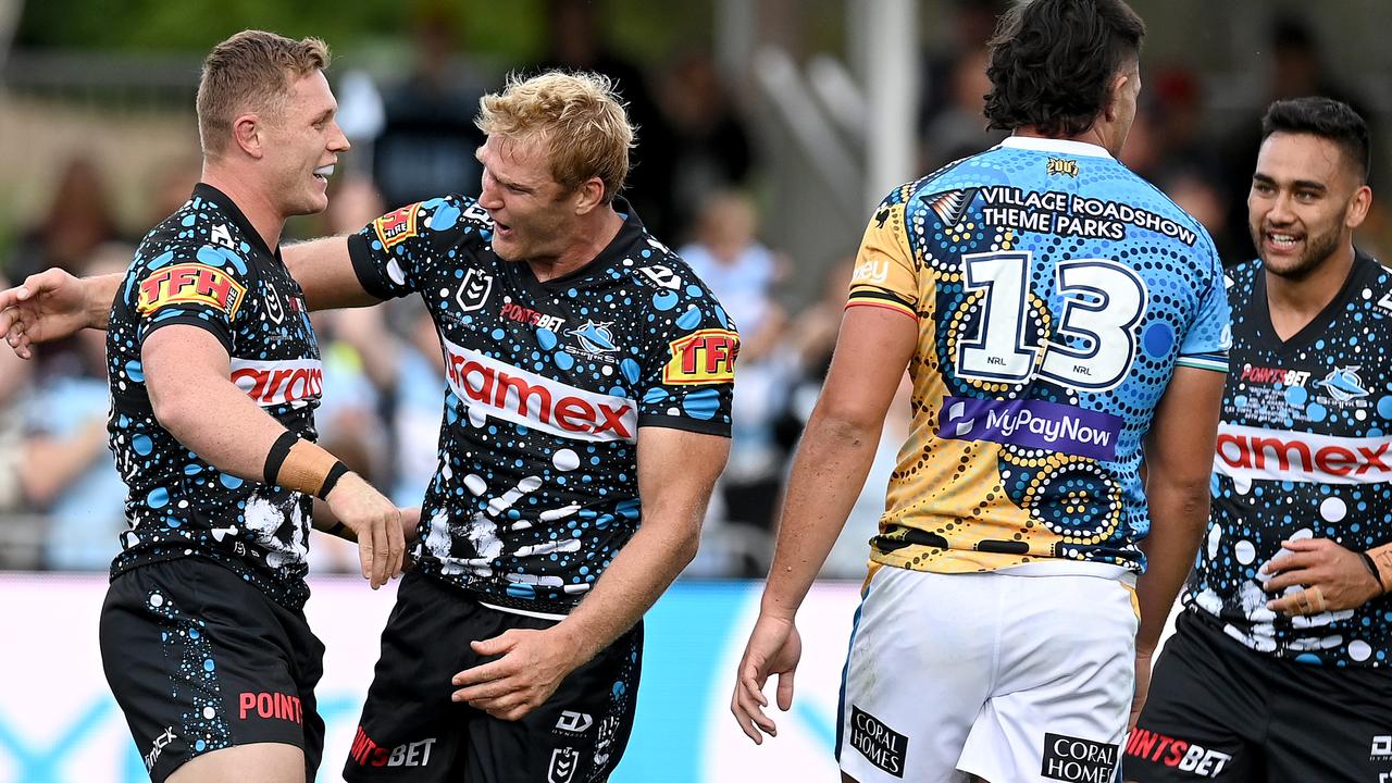 Jack Williams of the Sharks celebrates with teammate Aiden Tolman after scoring a try.