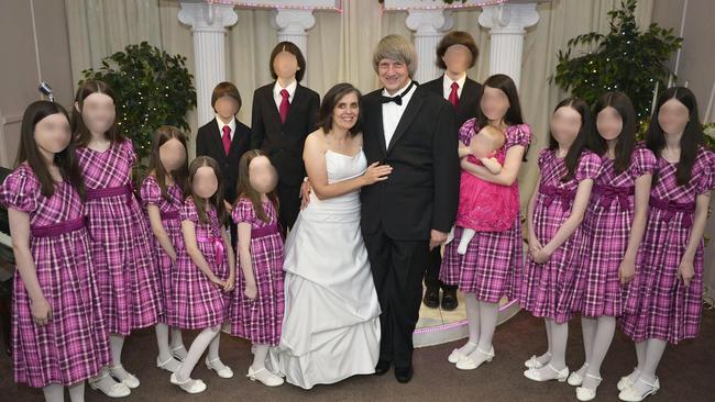 David Allen Turpin, 57, and Louise Anna Turpin, 49, surrounded by the 13 children they are accused of starving, shackling and abusing for years. Picture: Supplied