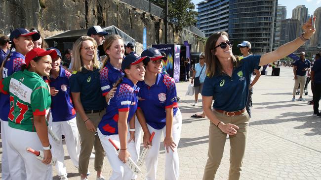 Sophie Molineux and Erin Burns of Australia take a selfie with young at the Sydney Opera House.