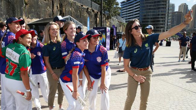 Sophie Molineux and Erin Burns of Australia take a selfie with young at the Sydney Opera House.