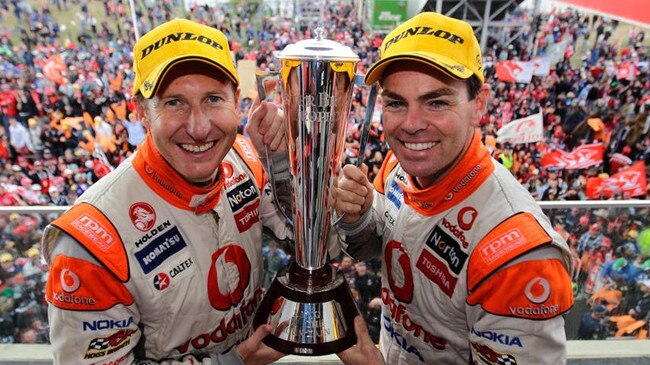 Craig Lowndes (right) and Mark Skaife celebrate their Bathurst 1000 win in 2010.