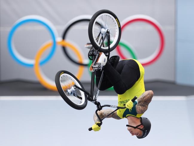 Logan Martin of Australia performs a backflip in front of the Olympic rings logo while he prepares for the race prior to the Men's BMX Freestyle seeding event on day eight of the Tokyo 2020 Olympic Games at Ariake Urban Sports Park on July 31, 2021 in Tokyo, Japan. Picture: Laurence Griffiths/Getty Images.