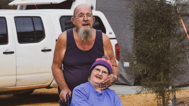 Bill and Sharen Lane in front of their caravan and ute. Picture Jason Katsaras