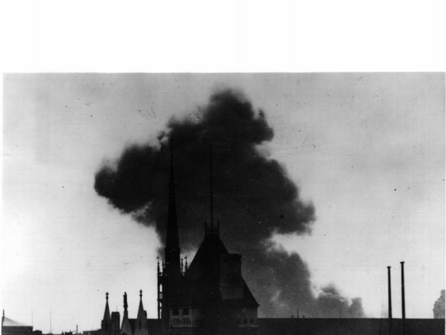 A photo taken from a Fleet Street roof-top showing a V-1 flying bomb actually crashing in Central London.