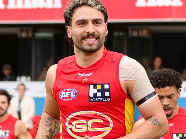 GOLD COAST, AUSTRALIA - JULY 31: Izak Rankine of the Suns enters the field before the 2022 AFL Round 20 match between the Gold Coast Suns and the West Coast Eagles at Metricon Stadium on July 31, 2022 in Gold Coast, Australia. (Photo by Russell Freeman/AFL Photos via Getty Images)