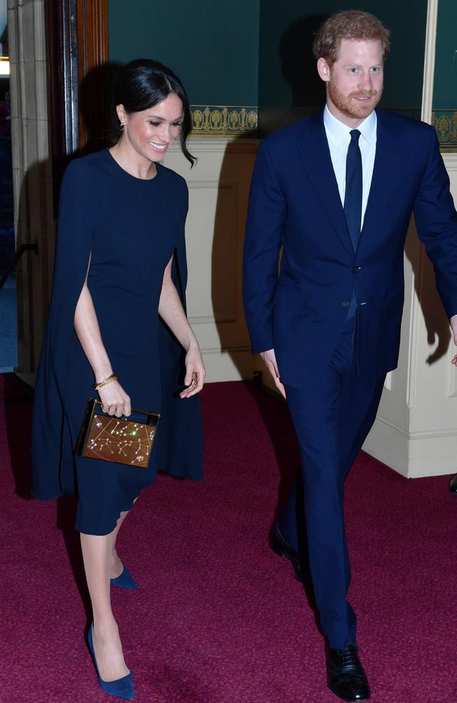 Meghan wore the same dress that was seen under her coat tonight, as she did at Royal Albert Hall attending a star-studded concert to celebrate the Queen's 92nd birthday in April. Picture: John Stillwell/WPA Pool/Getty Images