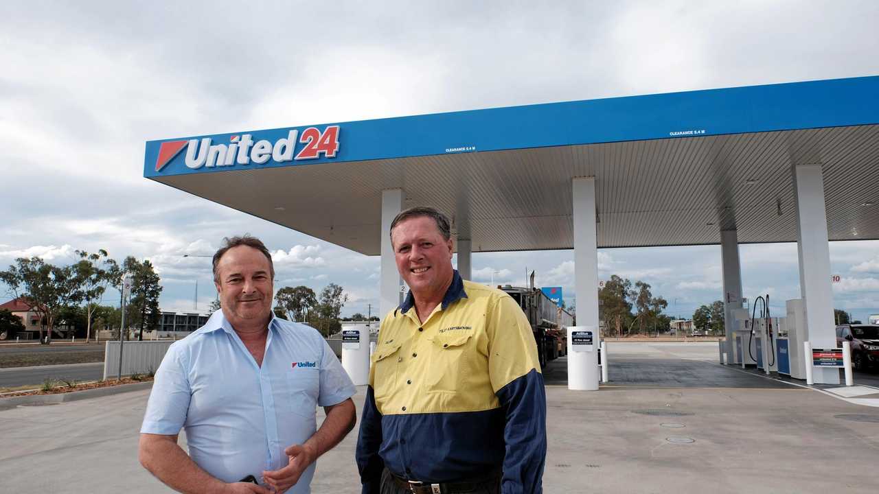 IN BUSINESS: United Petroleum food merchandiser Brian Glassel with Miles developer Glenn Tilly. Picture: Matthew Newton