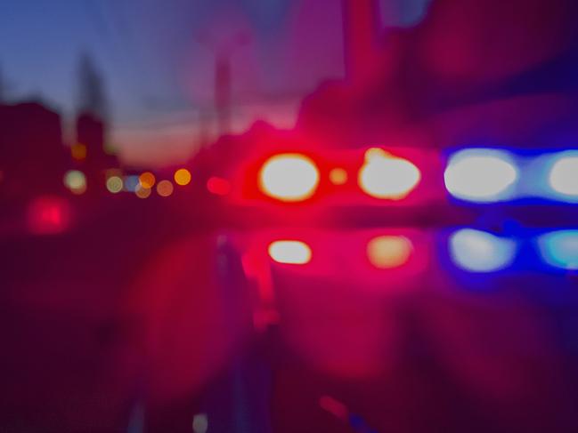 Red and blue Lights of police car in night time. Night patrolling the city. Abstract blurry image.