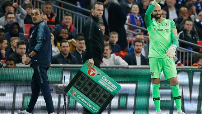 Chelsea's Italian head coach Maurizio Sarri (L) reacts after Chelsea's Spanish goalkeeper Kepa Arrizabalaga remains on the pitch after an attempt to substitute him for Chelsea's Argentinian goalkeeper Willy Caballero (R) during the English League Cup final football match between Manchester City and Chelsea at Wembley.