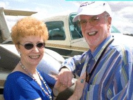 Martha and Leslie Nixon in front of their plane.