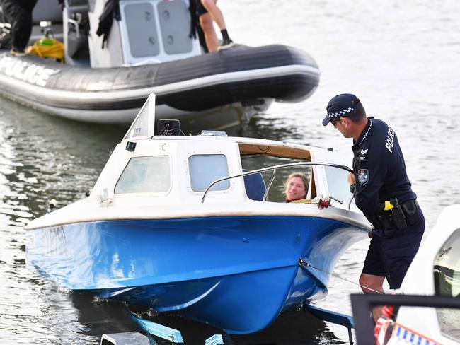 The capsized boat is returned to shore. Picture: Patrick Woods