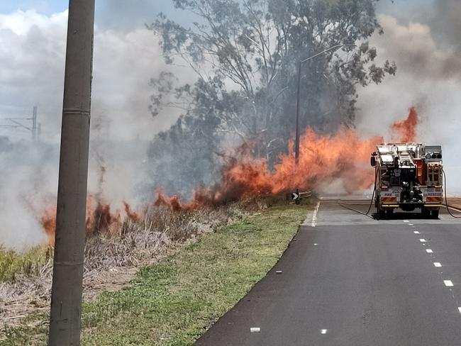 A fire that jumped Gladstone Benaraby Road at Glen Eden has shut the road to traffic. Picture: Rodney Stevens