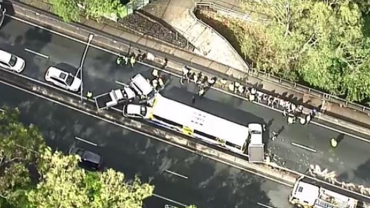 A crash between a bus and seven vehicle on the Centenary Mwy at the Jindalee Bridge, southbound. The area is a high crash risk. Photo: 9 News Queensland