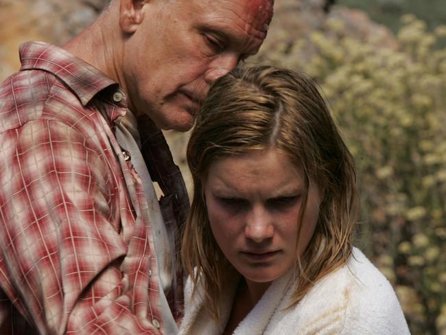 John Malkovich and Jessica Haines in scene from 2009 film 'Disgrace'.