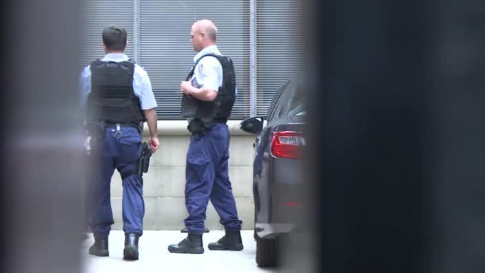 Lucky Gattellari is escorted to the NSW Supreme Court