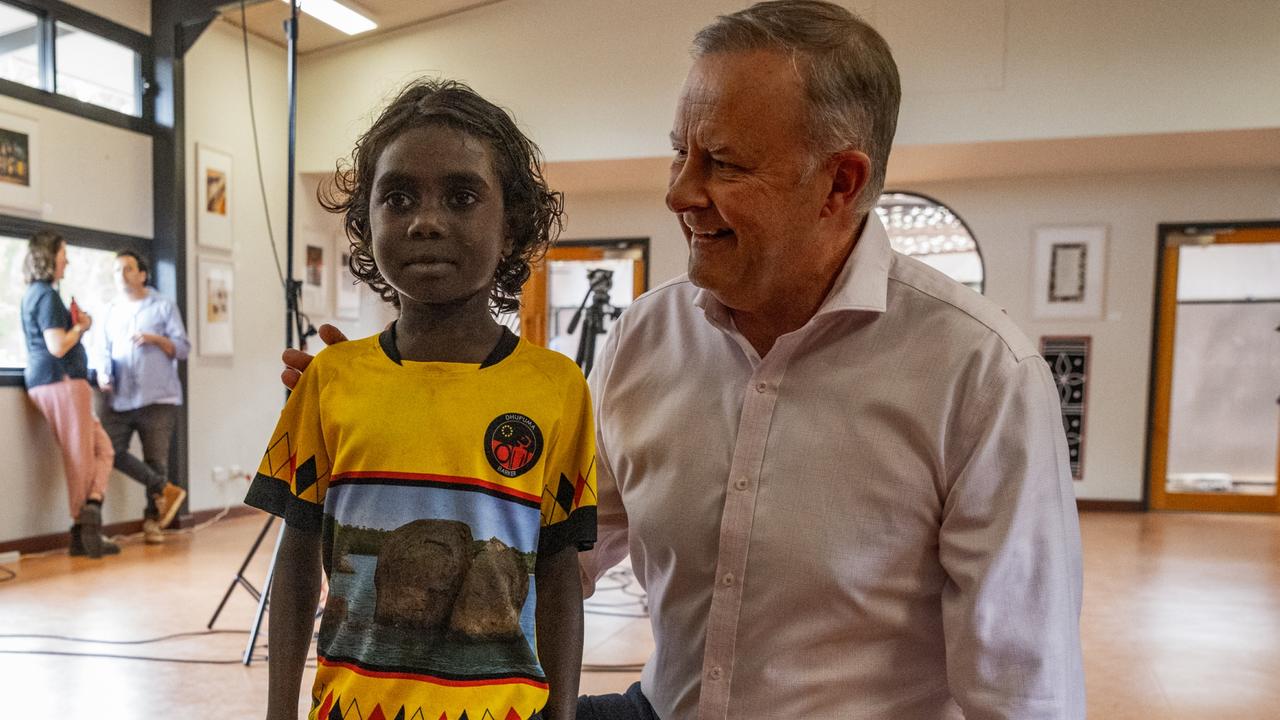 Prime Minister Anthony Albanese and a Dhupuma school student pose for a photo during the Garma Festival. Picture: Tamati Smith/Getty Images