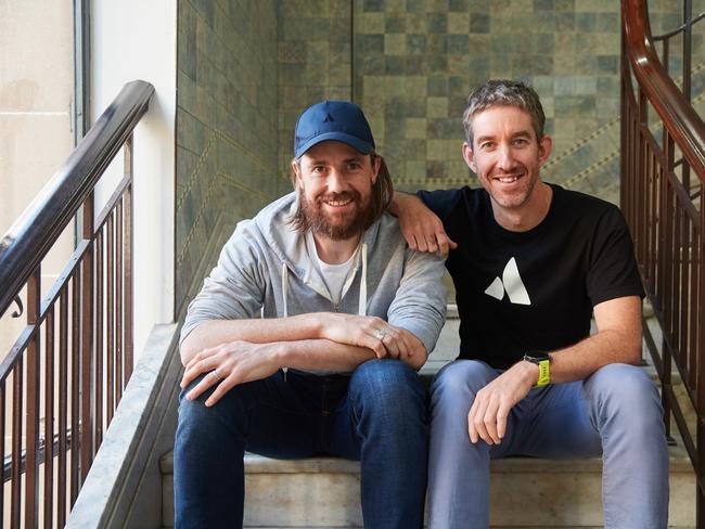 Mike Cannon-Brookes (baseball cap) and fellow founder of Atlassian, Scott Farquhar pictured together in their Sydney HQ