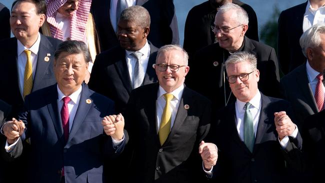 Prime Minister Anthony Albanese holds hands with Chinese President Xi Jinping and UK Prime Minister Keir Starmer at the G20 in Rio de Janeiro, Brazil, hours before the sentencing in Hong Kong. Picture: Getty Images