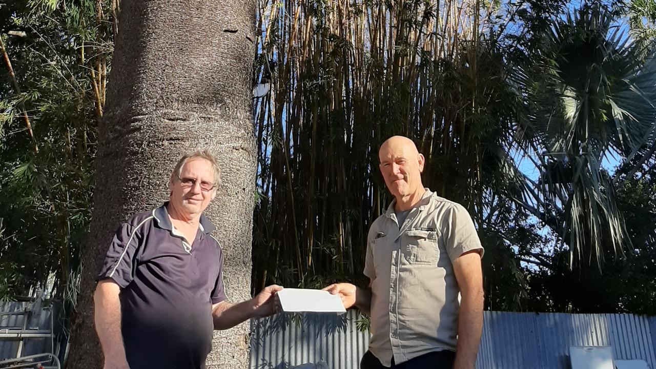 Barry Jensen was awarded a $50 Landcare Nursery voucher from Bundaberg Landcare President Mike Johnson for caring for a Hoop Pine.