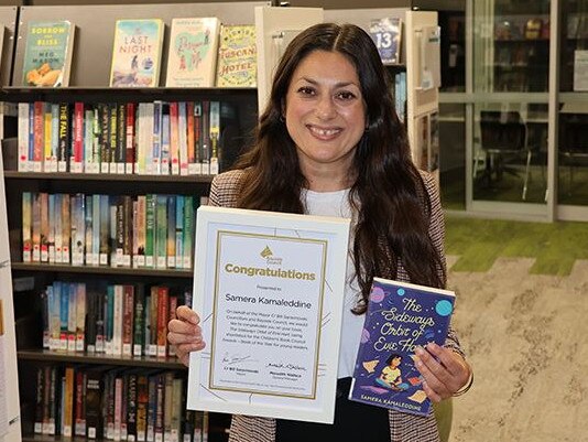 Samera Kamaleddine with her latest book and the acknowledgement from the Bayside Council. Picture: Lorraine Olmedo