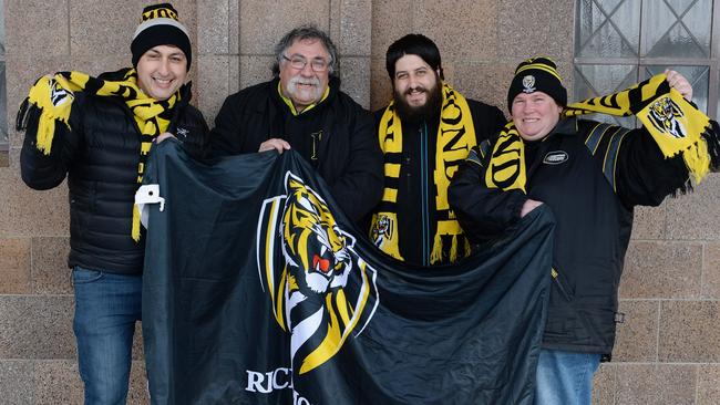 Tiger supporters Dino Krommydas, John Ioannou, Dennis Moschoyiannis and Kirsty Upjohn are already queuing outside the Ticketek outlet in Exhibition St. Picture: Lawrence Pinder