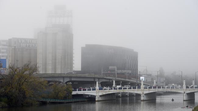 Melbourne is blanketed by a thick morning fog on Friday. Picture: NCA NewsWire/Andrew Henshaw