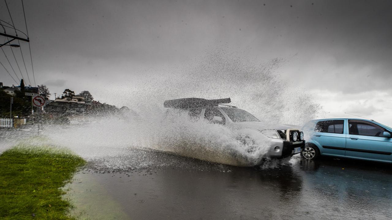 Weather: Wind and rain in Hobart. Minor flooding on Marieville Esplanade, Sandy Bay. Picture: Richard Jupe